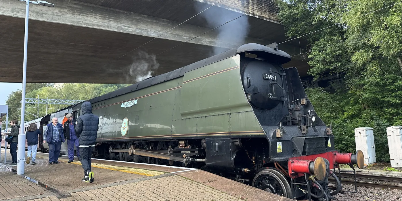 Tangmere steam engine under a bridge at Bradford Foster Square Railway Station