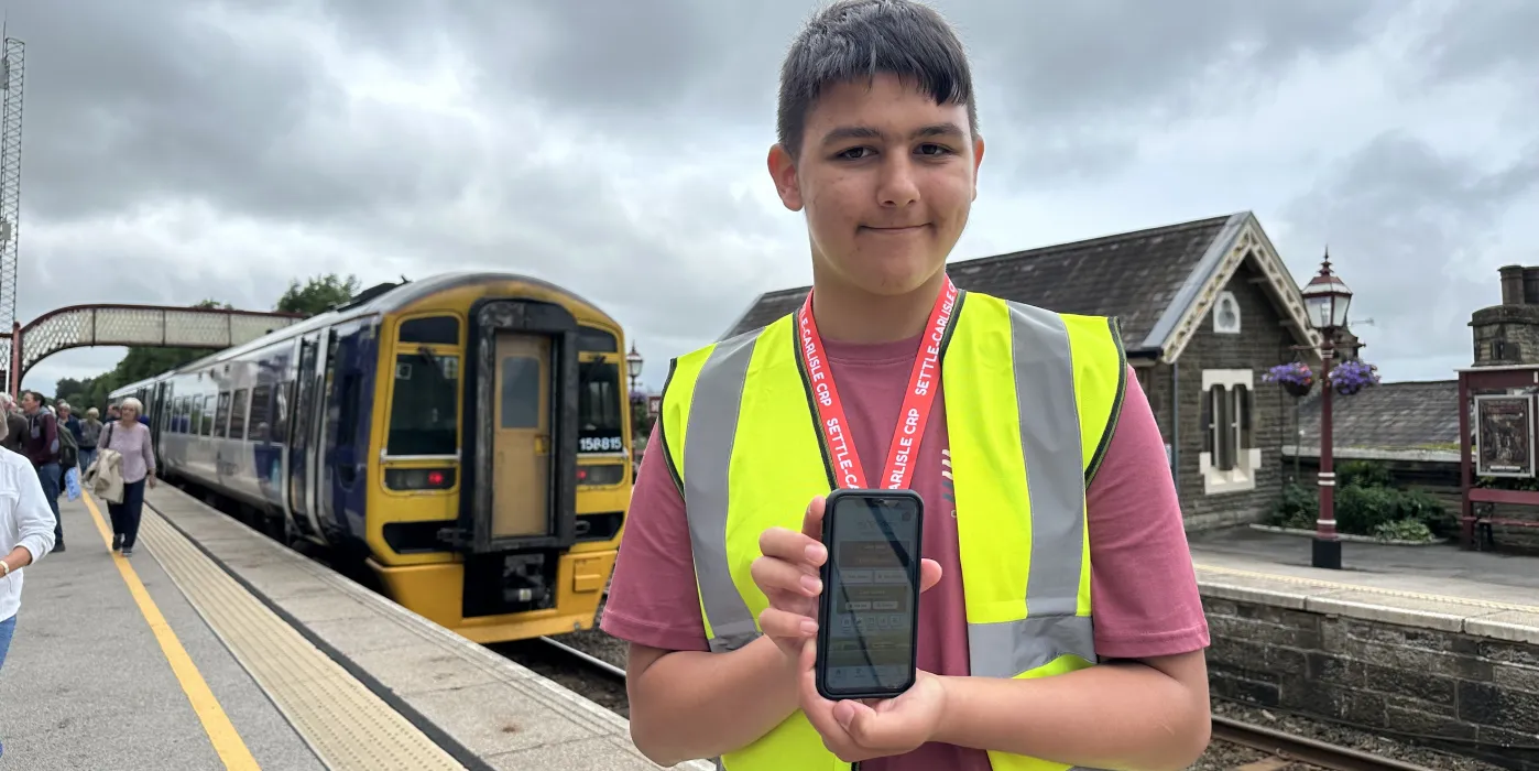 Young volunteer Kai Elliott gaining work experience this summer with the Settle Carlisle Traxplorer App.